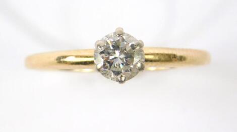 A diamond solitaire ring