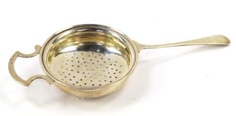 A George V silver tea strainer