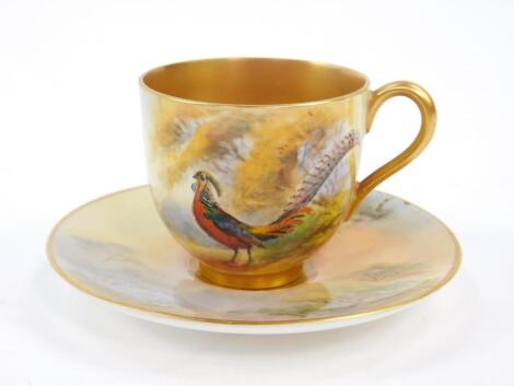 A Royal Worcester porcelain coffee cup and saucer