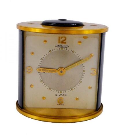 A Jaeger brass and black plastic cased alarm clock