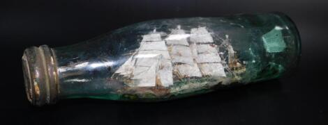 A late 19thC model of a Clipper Ship in a green glass bottle