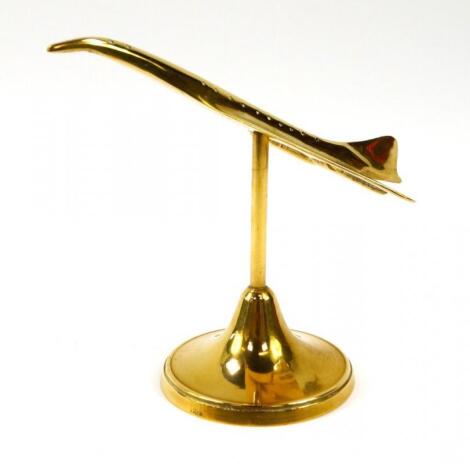 A brass paperweight modelled as Concorde