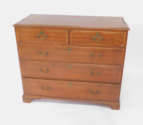 A George III oak and rosewood cross banded chest of drawers