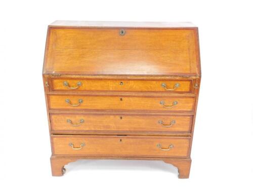 A George III oak and rosewood cross banded bureau