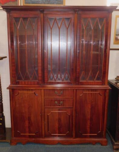 A Georgian style mahogany cupboard bookcase