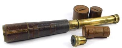 A Broadhurst Clarkson & Company brass three draw telescope, leather bound, and a cased optic. (2)