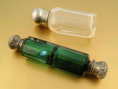 A Victorian double ended green glass scent bottle with glass stoppers under