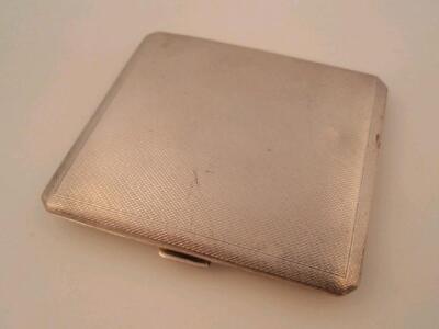 An engine turned silver cigarette case