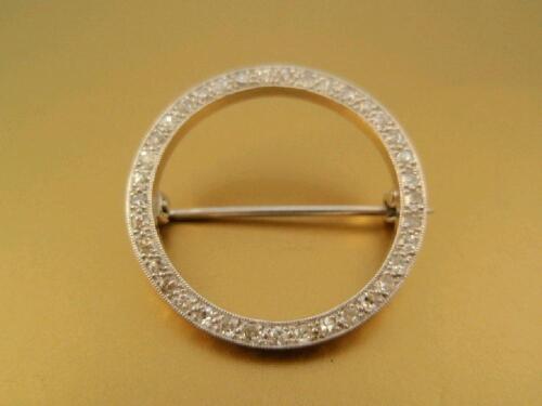 An open centre circular brooch