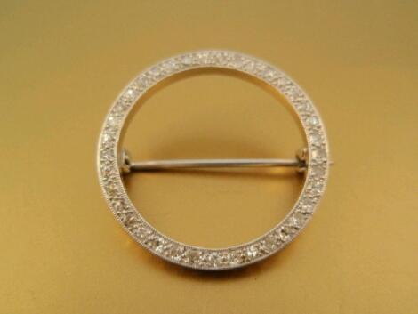 An open centre circular brooch