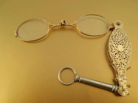 A pair of 18ct gold folding spectacles