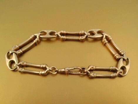 A fancy link yellow metal bracelet stamped 9kt