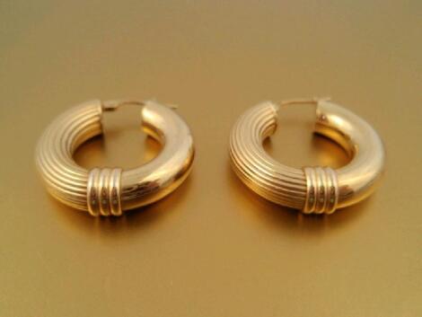 A pair of hollow hoop earrings