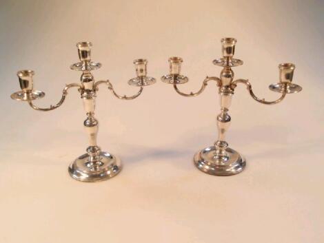 A pair of modern silver table candelabra by C J Vander Ltd