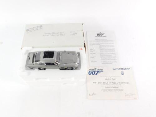 A Danbury Mint die cast replica of the James Bond 007 Aston Martin DB5