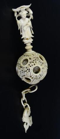 A late 19thC/early 20thC Chinese Canton style carved ivory concentric ball