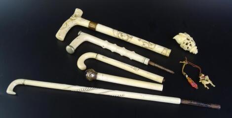 Various late 19th/early 20thC oriental and other carved ivory parasol handles etc.