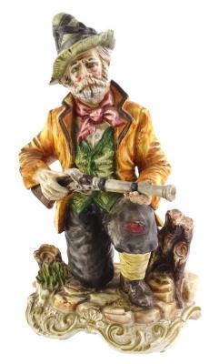 A Capodimonte ceramic figure of an old gentleman