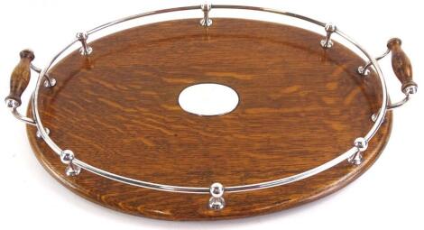 An Edwardian oak oval tray