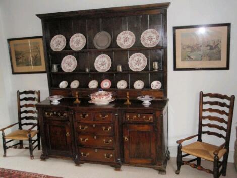 An 18thC and later oak dresser with associated plate rack