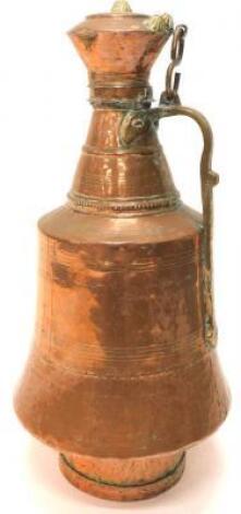 An Eastern copper and brass flagon or vessel