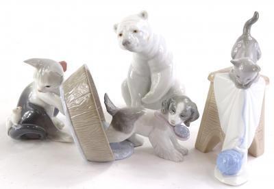 A collection of Lladro and Nao figures to include a polar bear