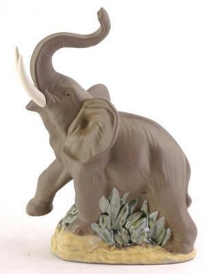 A Nao matte glazed porcelain figure of a rearing elephant