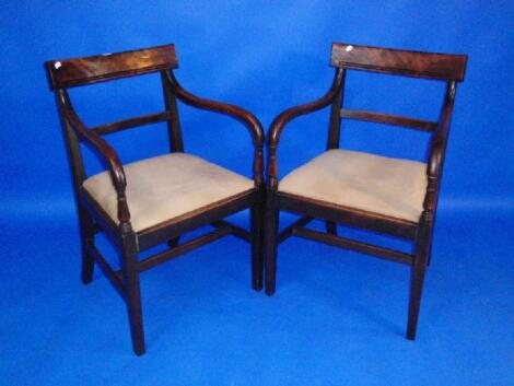 A pair of William IV mahogany bar back carver chairs with drop in seats