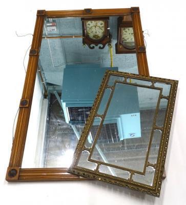 A 19thC walnut overmantel mirror with a moulded edge decorated with paterae etc.