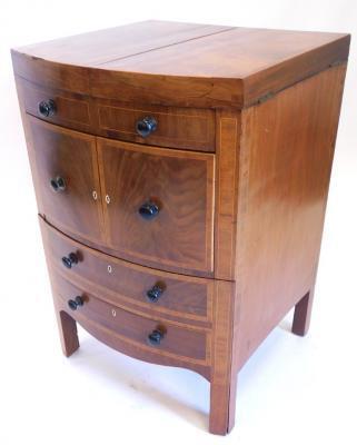 A early 19thC mahogany and bow fronted enclosed dressing table