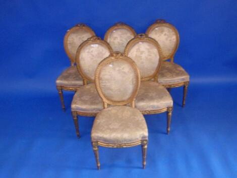 A set of six 19thC French gilt wood dining chairs with oval ribbon carved