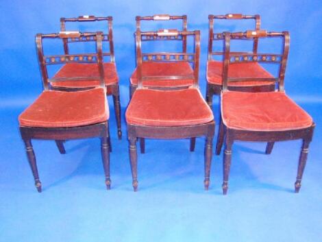 A set of six Regency mahogany dining chairs with bar and roundel backs