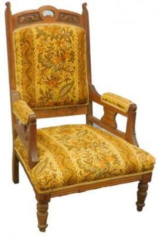 A Victorian walnut open armchair