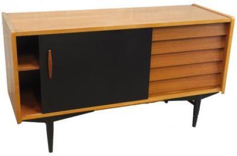 A Scandinavian teak sideboard designed by Neils Jonsson for Troeds