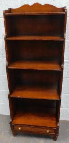 A cherrywood waterfall type bookcase