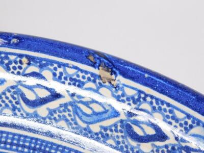 A 17thC style Islamic pottery blue and white charger - 6