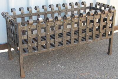 A cast iron dog grate