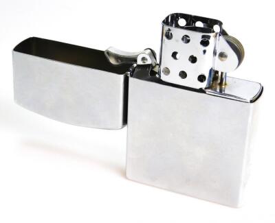 An enlarged chrome plated Zippo style lighter