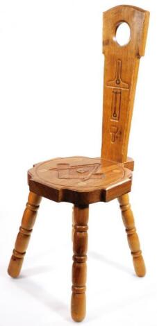 A 20thC four pronged spinning chair