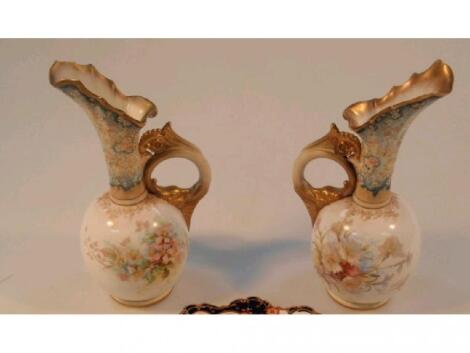 A pair of Doulton Burslem ewers