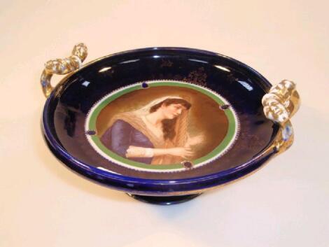 A late 19thC "Vienna" porcelain tazza painted with a female harpist to