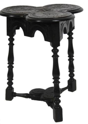 A late Victorian ebonised oak cloverleaf table
