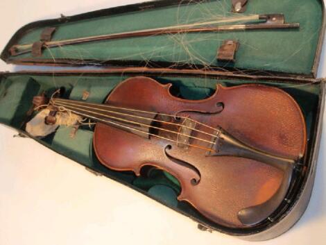 A cased violin with bow