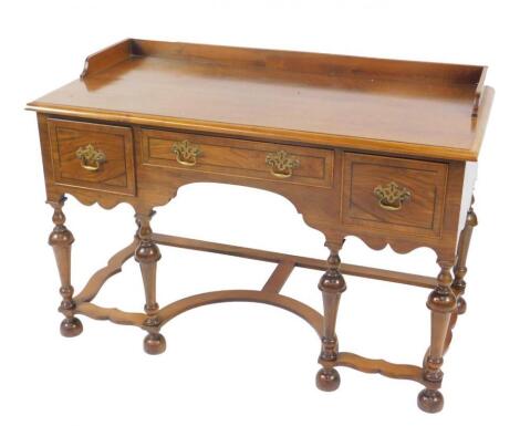 A William & Mary style walnut and mahogany cross banded dressing table