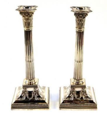 A pair of Victorian Corinthian column candlesticks