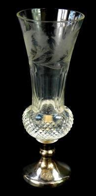 A cut glass and silver vase