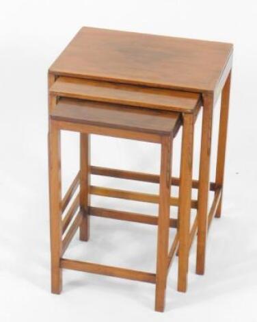 A nest of early 20thC walnut occasional tables