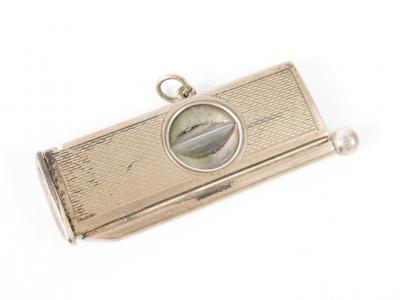 A silver cigar cutter and pricker