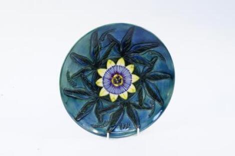 A Moorcroft Pottery Year Plate 1992 decorated in the Passion Flower pattern