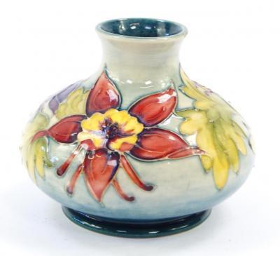 A Moorcroft pottery vase decorated in the Columbine pattern